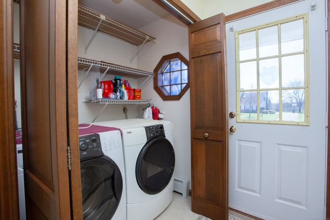 Laundry area and mudroom close to the garage. | Image 34