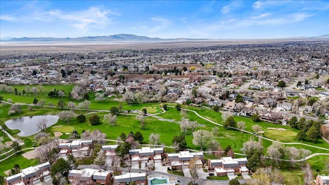 Drone / aerial view featuring golf course view, a water and mountain view, and a residential view | Image 41