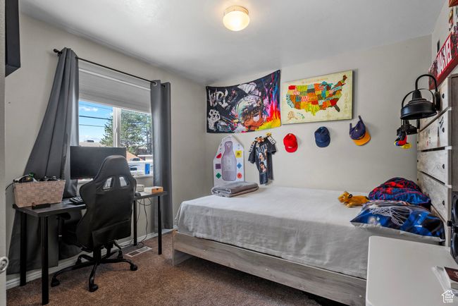 Bedroom featuring carpet floors and an office area | Image 18