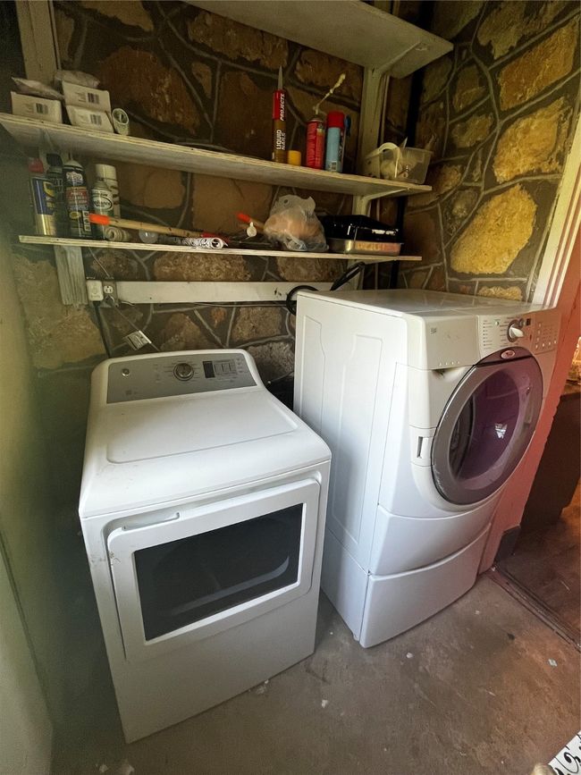 Laundry room with washing machine and dryer hookups and storage shelving | Image 20