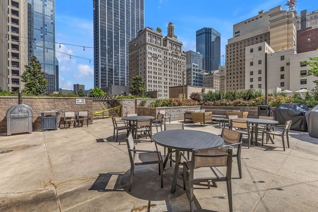View of patio / terrace featuring a grill and a view of city | Image 25