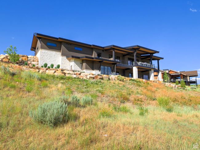Back of property featuring stone siding | Image 8