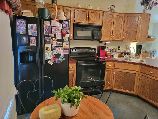 Refrigerator, stove/oven, microwave and dishwasher remain with home | Image 14