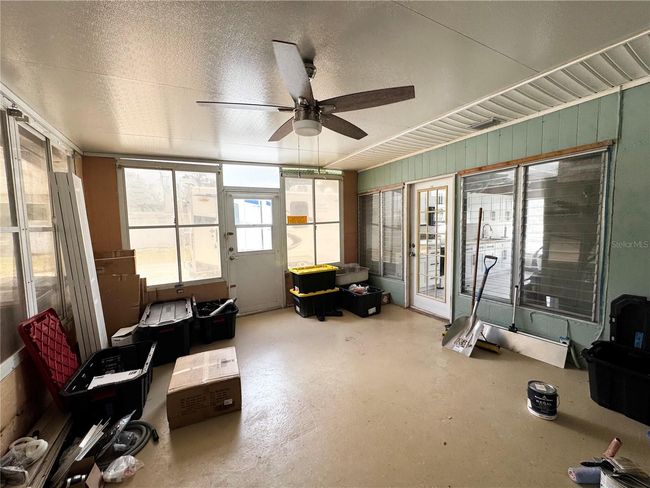 Florida room off the other side of the kitchen at the back of the house | Image 38