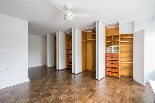 Unfurnished bedroom with baseboards and a ceiling fan | Image 15
