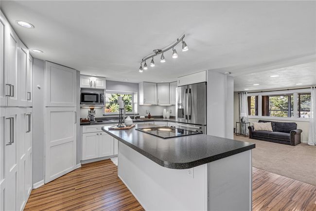 The large pantry and large island create ease & flow while food prepping. | Image 4