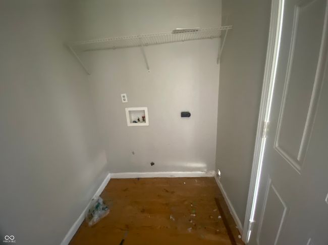 clothes washing area featuring hookup for a washing machine, gas dryer hookup, laundry area, and baseboards | Image 8