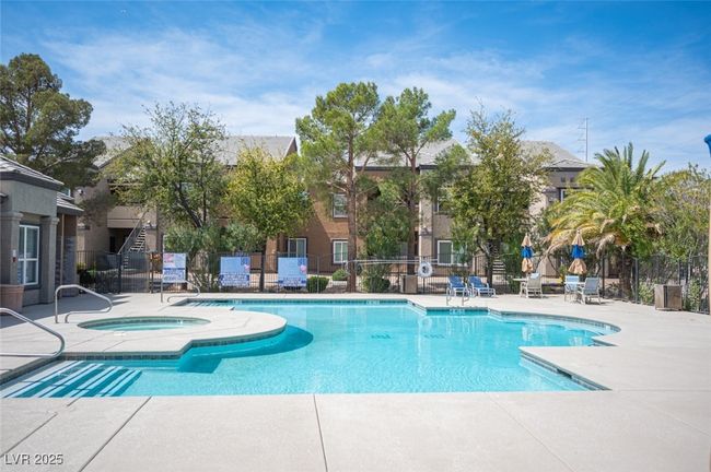 Community pool featuring a patio area, a community hot tub, and fence | Image 35