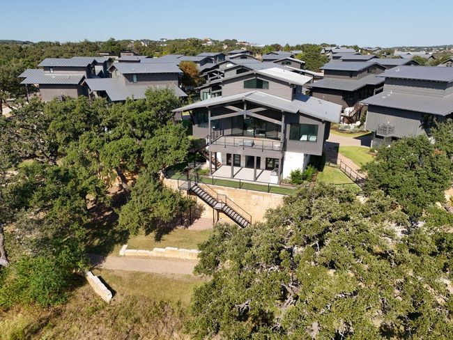 For nature lovers, a private stairway leads to a scenic walking path, perfect for leisurely strolls. | Image 39