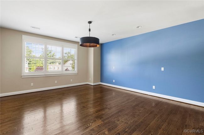 Spare room featuring baseboards and dark wood-style floors | Image 29