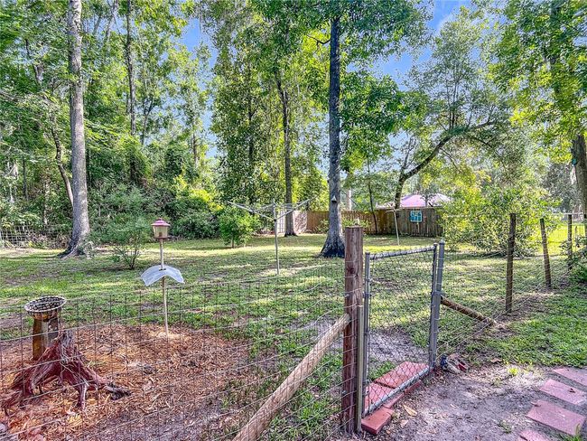 View of the fenced in back yard | Image 37