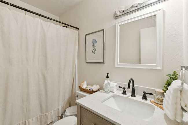 2nd Bath featuring baseboards and wood finished floors | Image 13