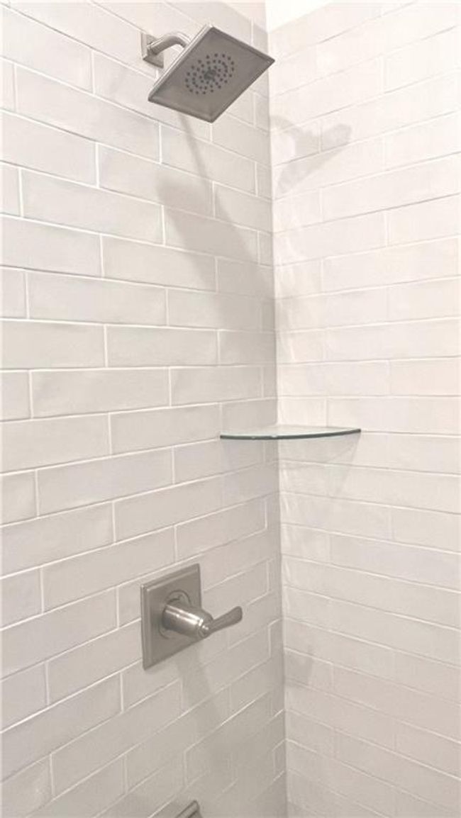 Bathroom view of a tile shower | Image 34