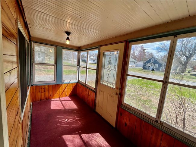 Porch leading to Living Room on front of home | Image 10