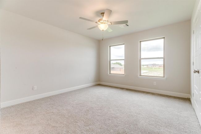 Carpeted empty room with ceiling fan | Image 16