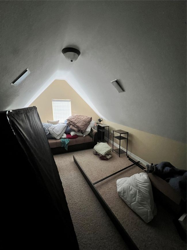 Bedroom with carpet and vaulted ceiling | Image 15