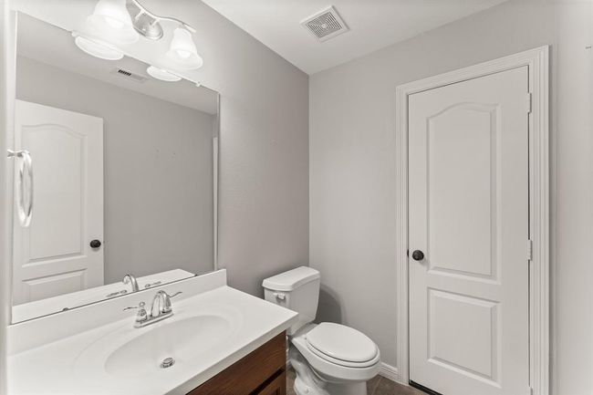 Upstairs half bath conveniently located off the game room | Image 39