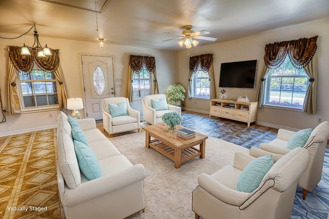 Virtually staged photo of living room in guest house | Image 27