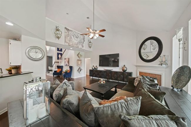 The open-concept layout connects the family room to the casual dining area and kitchen, creating the perfect space for entertaining and everyday living. | Image 16
