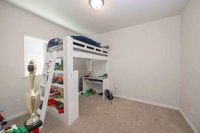 Carpeted bedroom featuring baseboards | Image 19