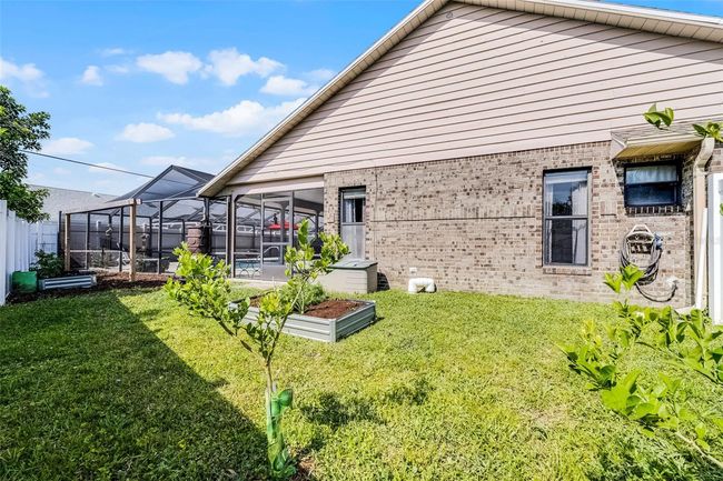 Left side yard with raised gardens | Image 33
