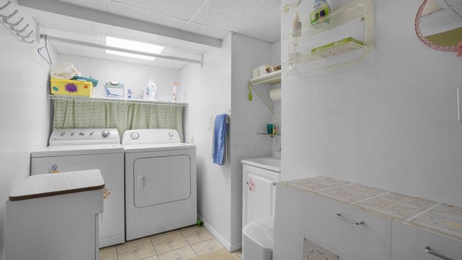 Bathroom featuring shower / bath combo, toilet, and vanity | Image 23