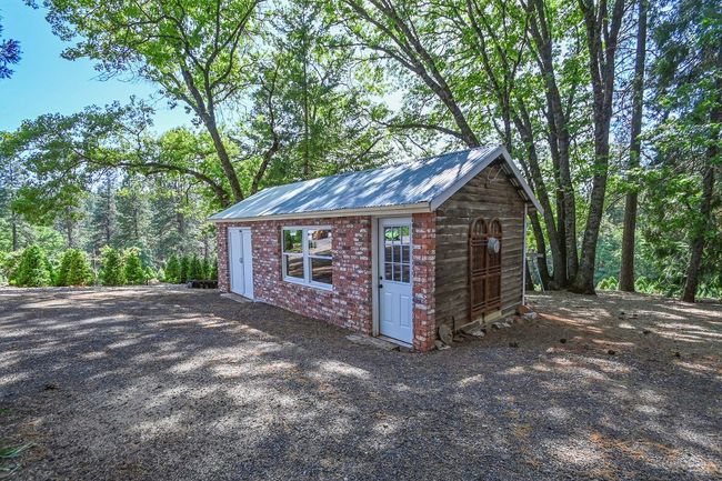 Outdoor shed with brick front. | Image 40