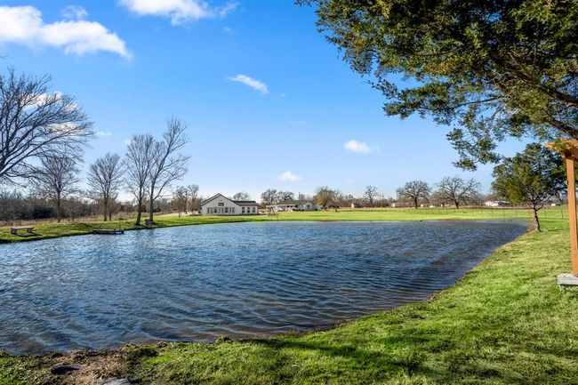 Expansive views of the pond and open land create a peaceful backdrop for outdoor living and everyday moments. | Image 41