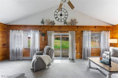 Sliding glass doors leading to the patio area with Gazebo to the back yard | Image 3