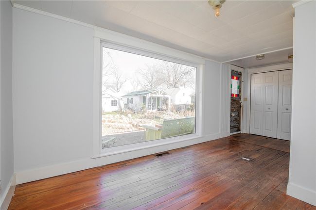 Enjoy the gorgeous backyard from the sunroom. | Image 11