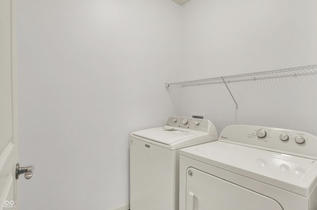 washroom with washer and dryer | Image 16