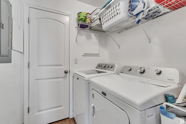 Washroom with separate washer and dryer and light tile patterned flooring | Image 18