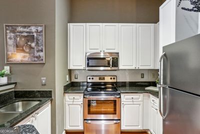 Updated Kitchen With Stainless Steel Appliances | Image 2