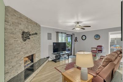 Den/living room with direct access to back yard. | Image 1