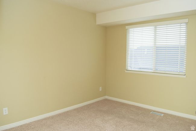 Empty room featuring visible vents, baseboards, and carpet | Image 8