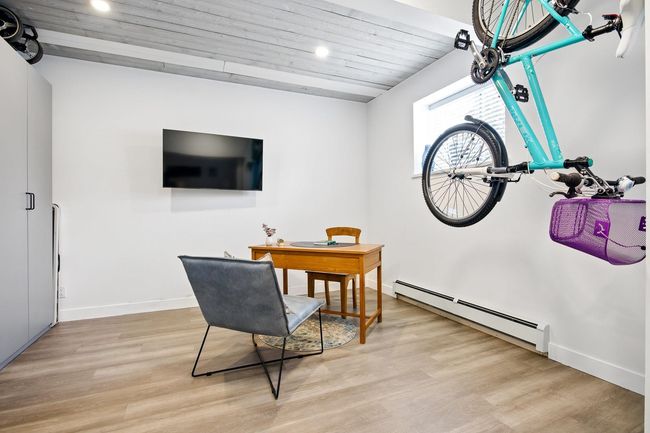 Office with light wood finished floors, baseboard heating, recessed lighting, and baseboards | Image 28