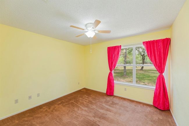 Second bedroom looking out to the front of the house. | Image 18