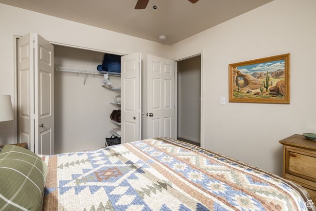 Bedroom with ceiling fan and a closet | Image 26