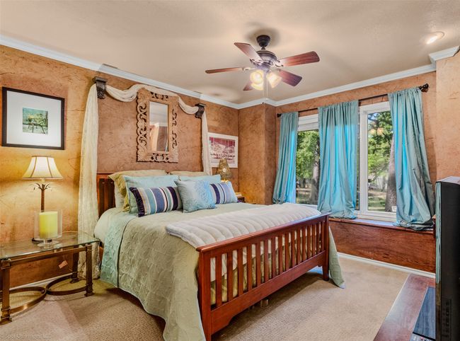 Guest Bedroom with carpet, ceiling fan, and built ins | Image 19