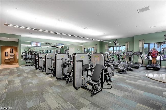 Exercise room featuring carpet floors and visible vents | Image 36