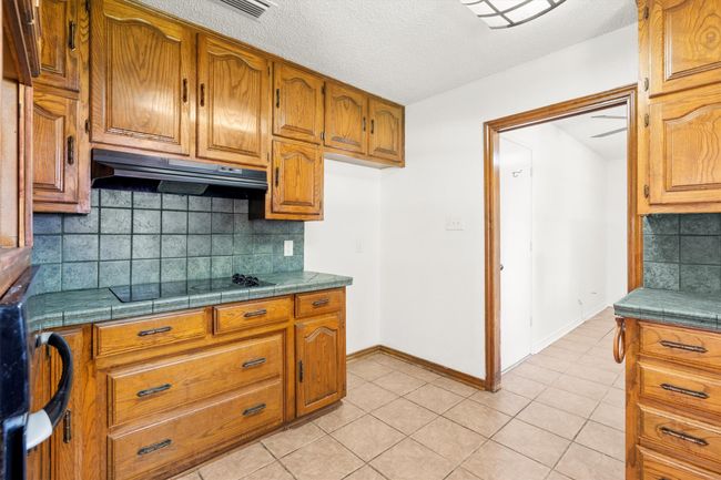 Kitchen looking into large laundry room | Image 11
