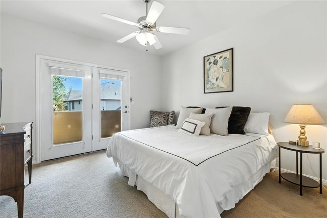 Carpeted bedroom featuring access to exterior and a ceiling fan | Image 29