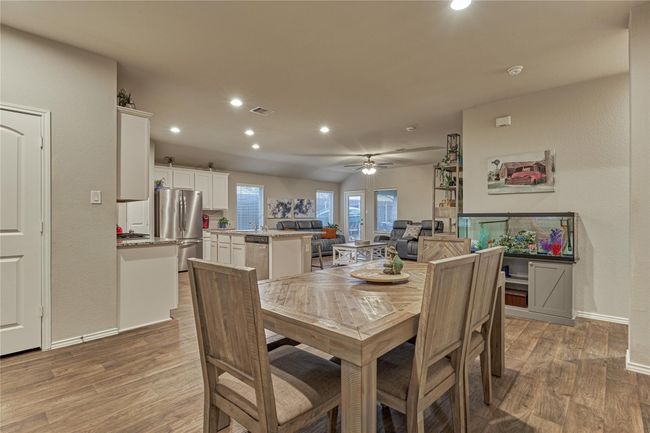 The dining room is open to living and kitchen and has plenty of space for any size gathering. | Image 15