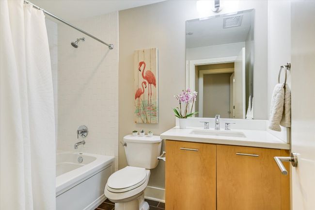 Bathroom with vanity, shower / tub combo, and toilet | Image 14