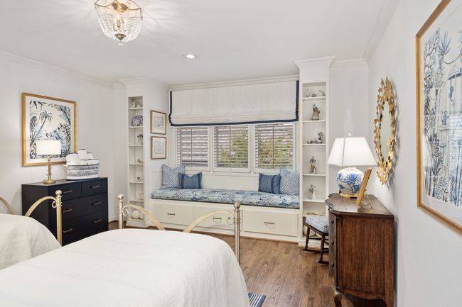 2nd guest room with built in shelving and window seat | Image 26
