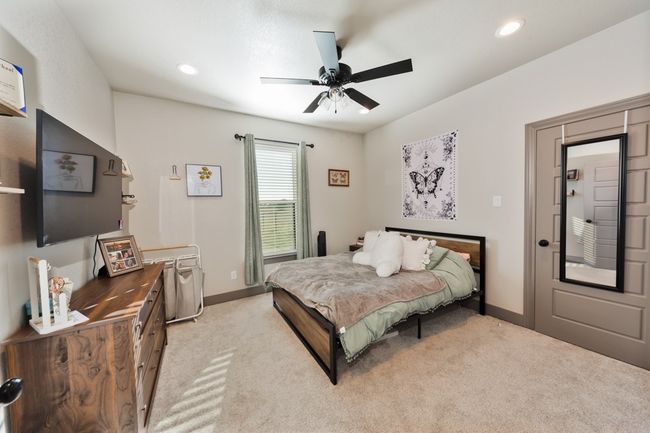 Bedroom with baseboards, recessed lighting, and light carpet | Image 12