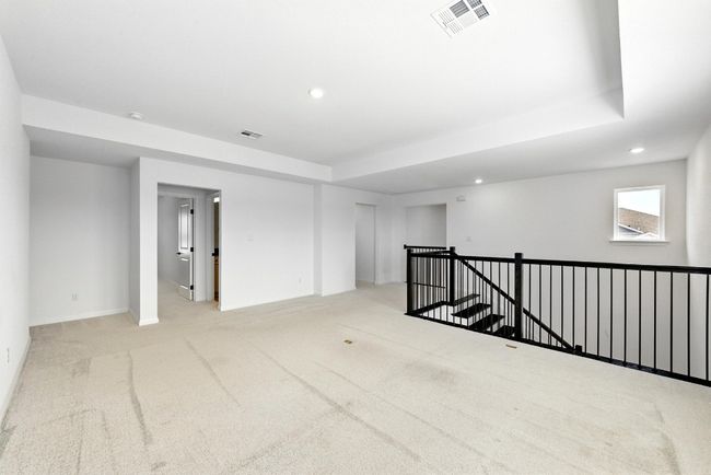 Unfurnished room featuring carpet flooring, recessed lighting, baseboards, and a raised ceiling | Image 23