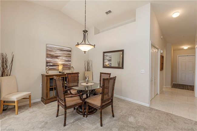 Dining area right off the kitchen for easy access, vaulted ceiling | Image 12