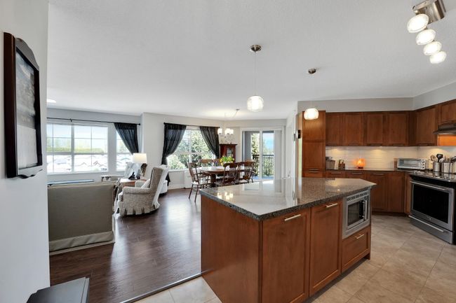 423 - 19673 Meadow Gardens Way, Condo with 2 bedrooms, 2 bathrooms and 2 parking in Pitt Meadows BC | Image 2