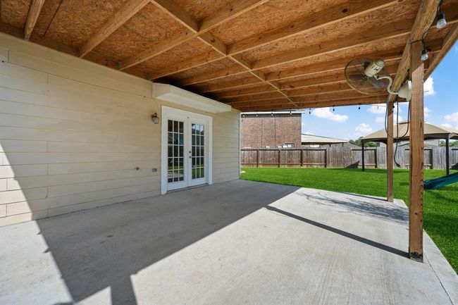 Extended covered patio—perfect for outdoor dining and lounging. | Image 23